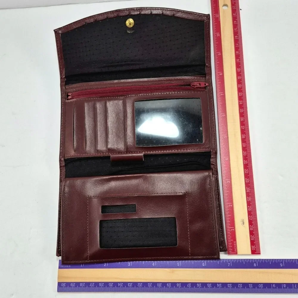 Vintage Full-Grain Cowhide Checkbook-Style Wallet With A Snap Closure.